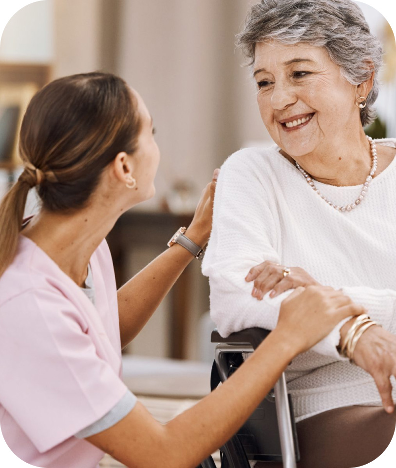 Caregiver and senior woman laughing Gallery